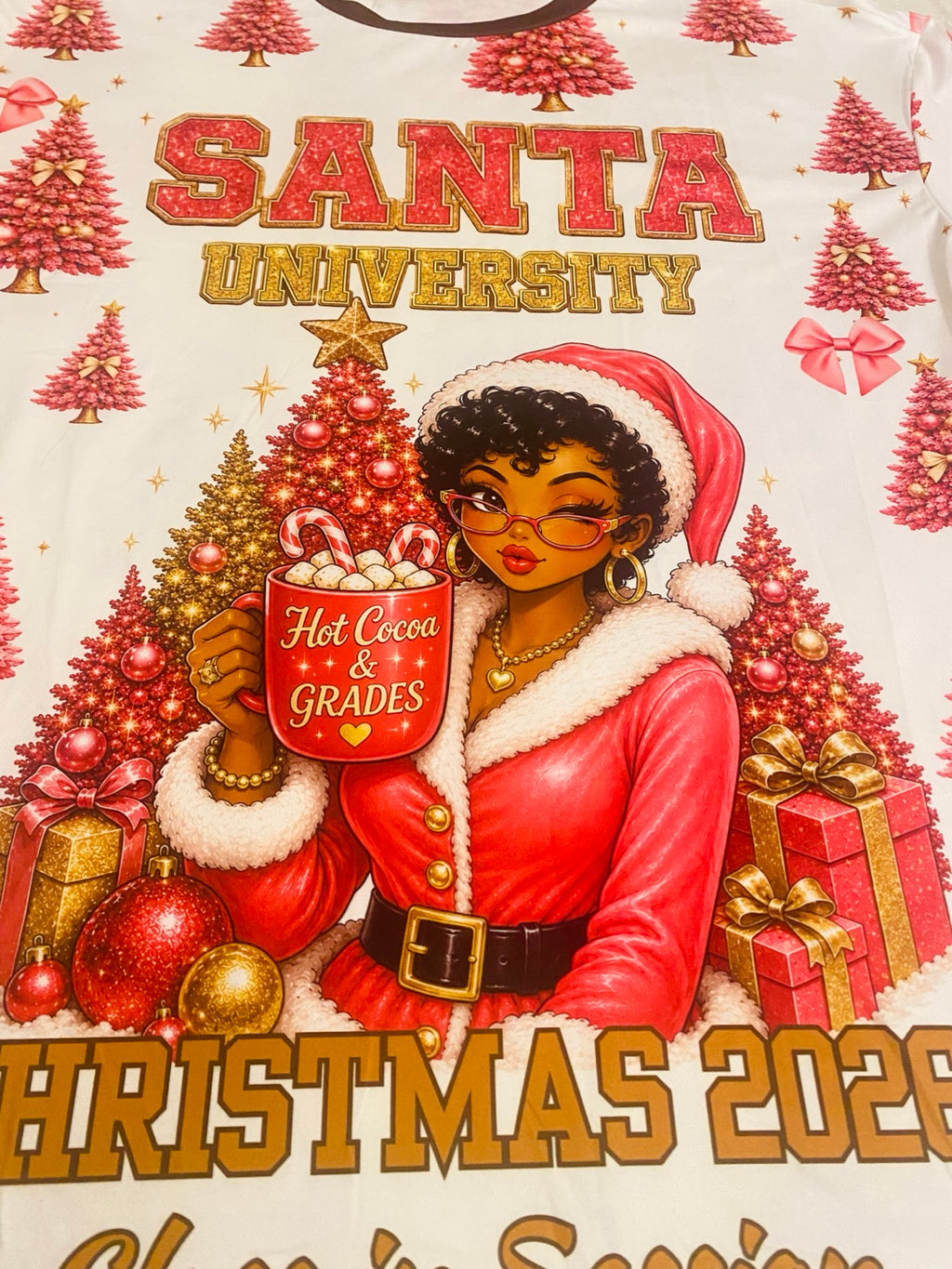 Close-up of Black Mrs Claus Hot Cocoa and Grades artwork on the Jinglemoo