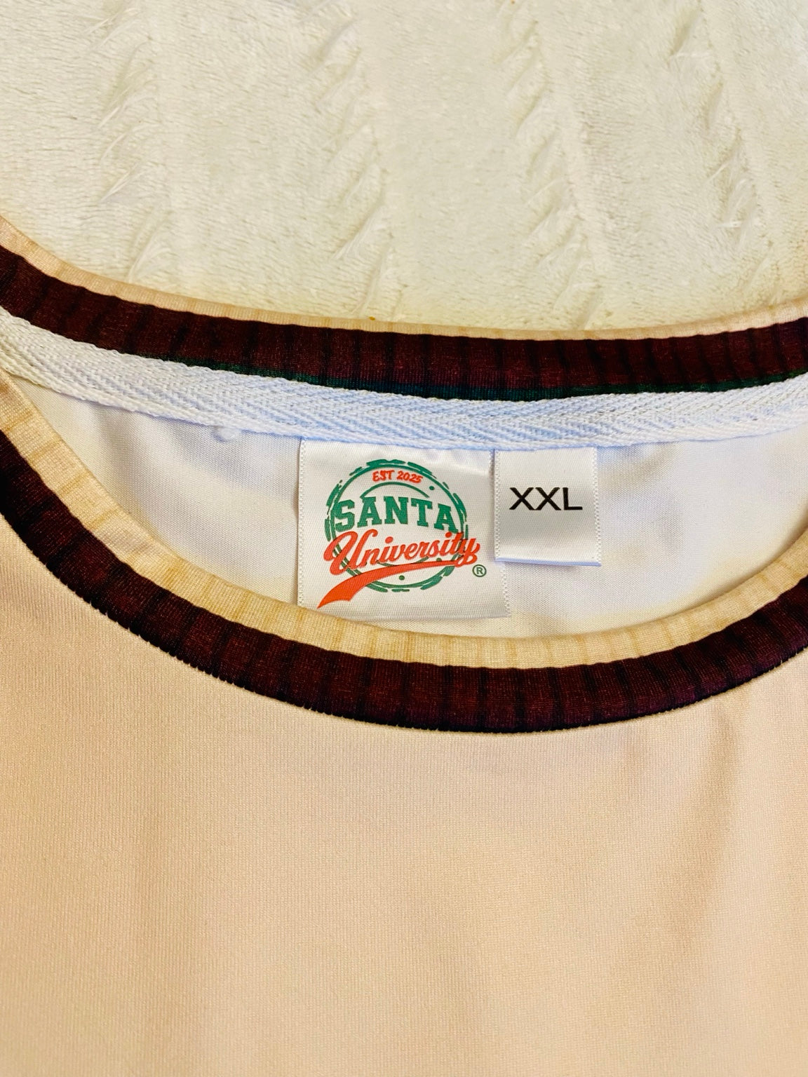 Santa University sewn brand label and XXL size tag inside the Argyle Jinglemoo neckline